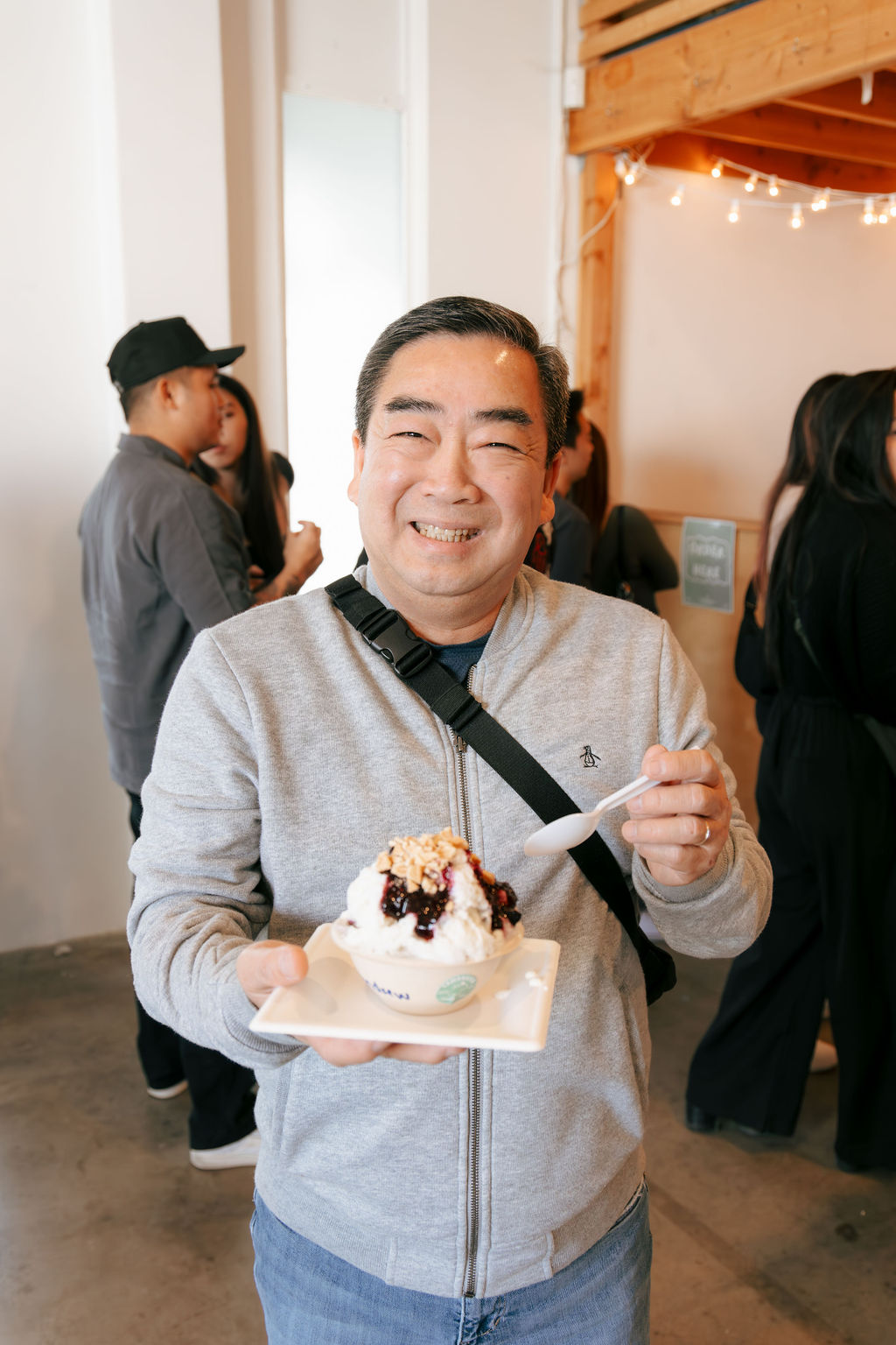 Happy guest with blueberry cheesecake shave ice