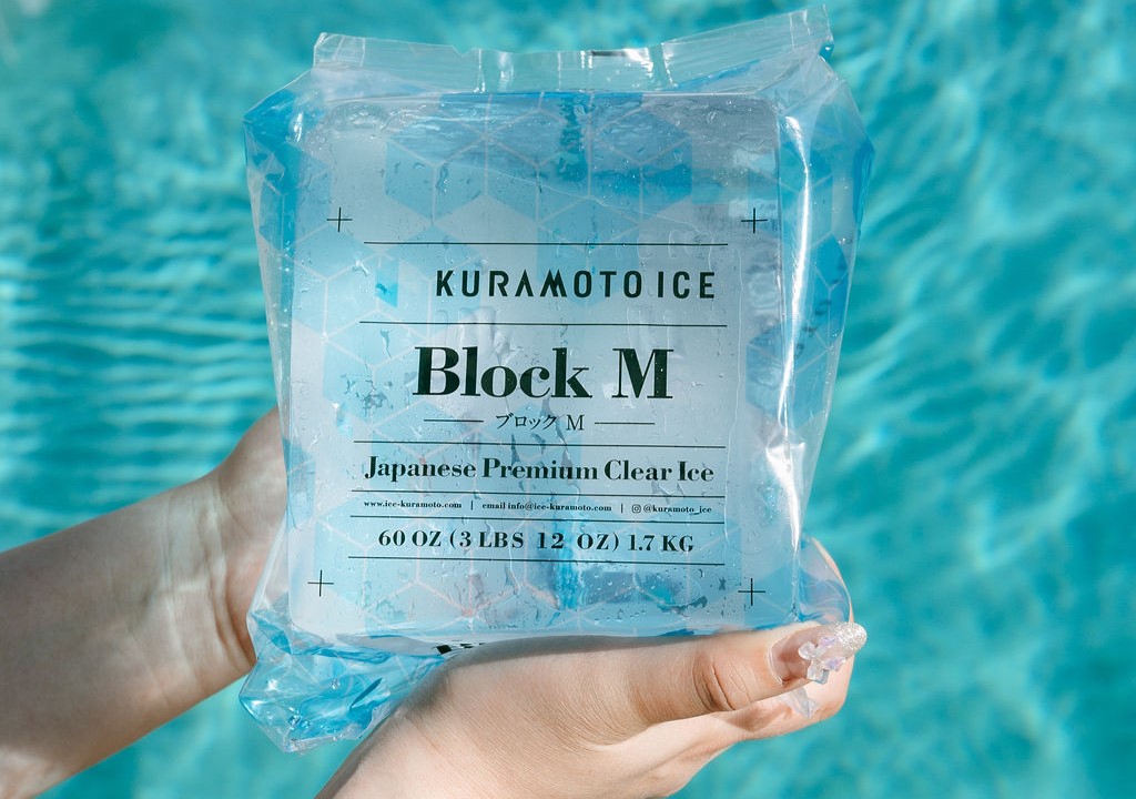 A block of Kuramoto clear ice held up to the light